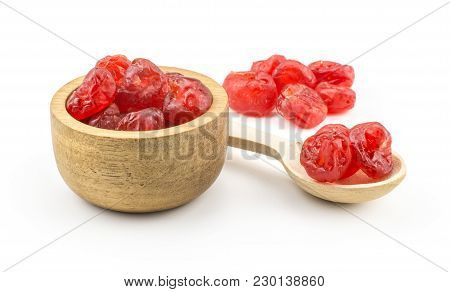 Red Dry Cherries In A Wooden Bowl With A Spoon Isolated On White Background