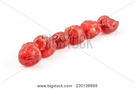 Red Dry Cherries Six In Row Isolated On White Background