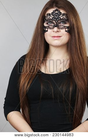 Pretty Mysterious Woman Wearing Black Eye Lace Mask Having Long Brown Hair.