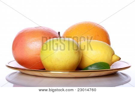 Fresh Useful Fruits On Mirror Table
