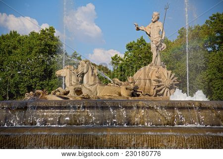 Typical Neptuno Fountain In Paseo De La Castellana, Madrid, Spain