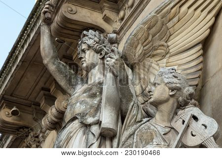 Architectural details of Opera National de Paris: Dance Facade sculpture by Carpeaux. Grand Opera (Garnier Palace) is famous neo-baroque building in Paris, France - UNESCO World Heritage Site.