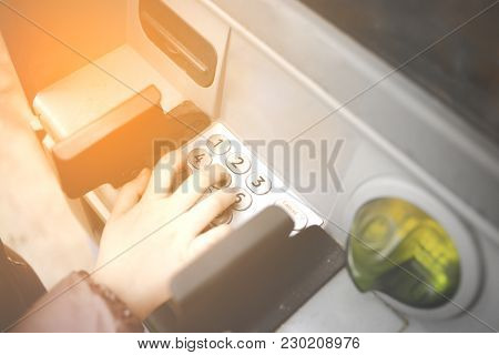 Little Child , Kid Entering Pin Numbers On Atm Bank Machine . Concept Of Insecure Minors Teens Onlin