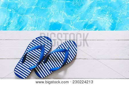 Blue Flip-flops On The Swimming Pool Background