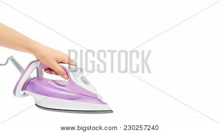 Young Woman's Hand Holding Iron On White Background. Copy Space, Template