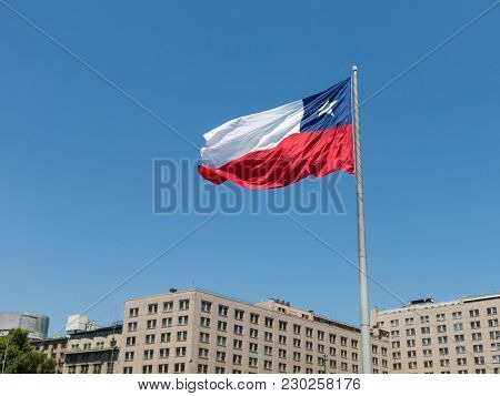 Chileans Walking Near The Giant Flag On Avenida La Alameda With The Citizenship Square, In Downtown 