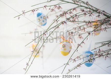 Spring Decoration, Bouquet Of Blooming Genista Or Broom With Hanging Painted Easter Eggs, Light Gray