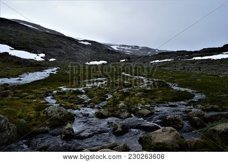 Small Stream And Mountain In Norway National Park