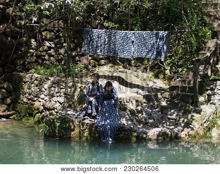 Chinese Lady Washing Her Clothes At The River At The Local Village Nearby Three Gorges Dam. Travel I
