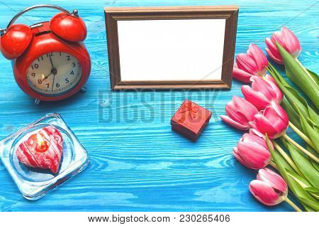 Tulip Flowers Wedding Ring In A Gift Present Box And Empty Photo Frame Of A Loved One Copy Space On 