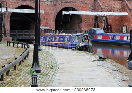Manchester, Uk. Historic Castlefield District, Waterway Canal Area With Narrowboats.