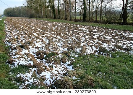 View Of A Field Plowed In Winter