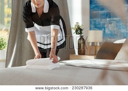 Chambermaid Preparing Hotel Room