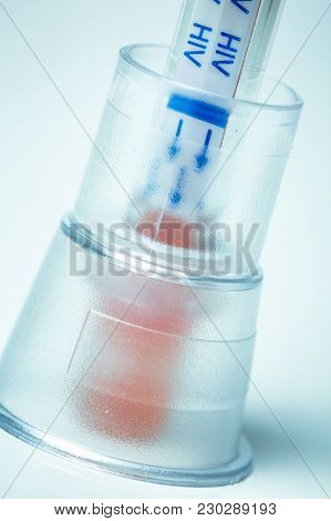 Closeup On Hiv Self-test With Blood Inside. Home Kit To Make Yourself