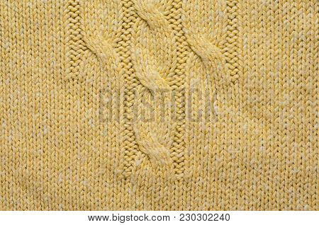 Knit Texture of Beige Wool Knitted Fabric with Cable Knits Pattern. Blank Background
