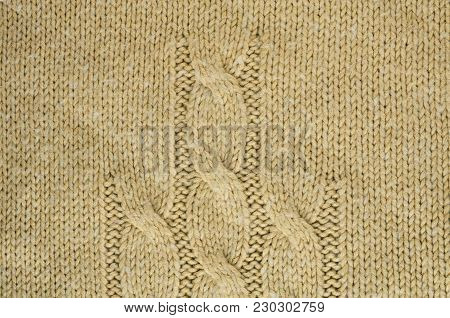 Knit Texture of Beige Wool Knitted Fabric with Cable Knits Pattern. Blank Background
