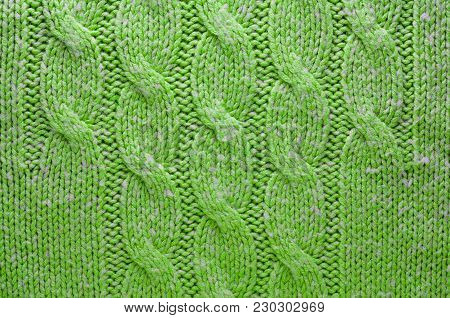Green Knit Texture of Green Wool Knitted Fabric with Cable Knits Pattern. Blank Background