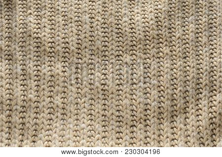Knit texture of wool knitted fabric with regular pattern as background