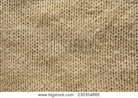 Knit Texture of Beige Wool Knitted Fabric with Regular Pattern. Knit Sweater Blank Background