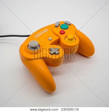 Bangkok, Thailand - March 7, 2018: Nintendo Gamecube Controller In Orange Color, Vintage Portable Ga