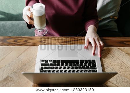 Female Working On Laptop In A Cafe. Woman Using Laptop In Home. Using Laptop Internet. Hand Using La