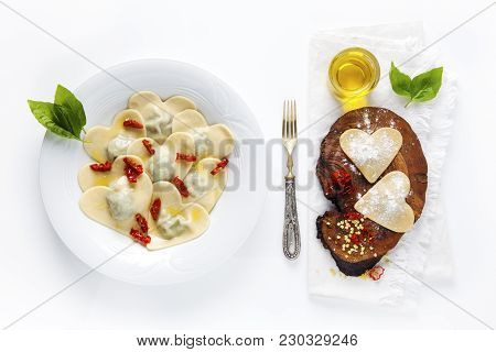 Heart Shaped Food. Delicious Ravioli. Freshly Homemade. Cooked In A Plate And Undercooked On A Board