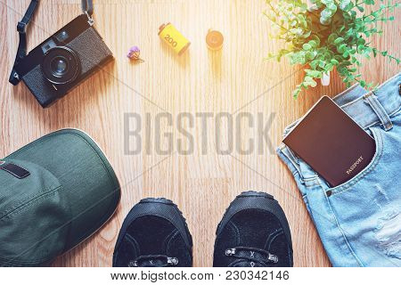 Travel Concept Background , Camera - Cap - Shoes - Casual - Passport On Wood Table With Copy Space
