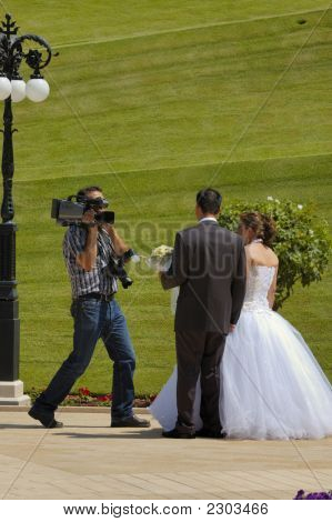 คู่บ่าวสาวและ Cameraman