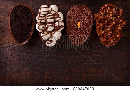 Chocolate Egg Ith Filling For Easter On Wooden Background