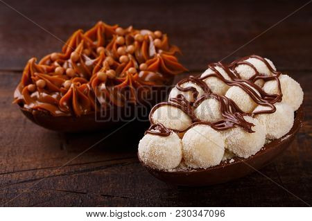 Chocolate Egg Ith Filling For Easter On Wooden Background