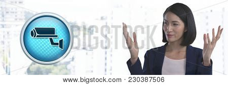 Digital composite of Security camera icon and Businesswoman with hands palm open in city