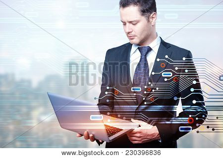 Businessman Using Laptop On Abstract Blurry City Background With Circuit Board And Copy Space. Techn