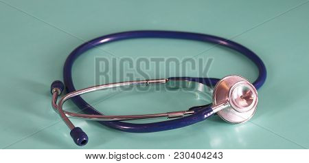 Medical Concept. Top View Of Stethoscope, Clipboard, Pen And Eye Glasses On Blue Background. Flat La