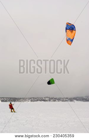 Perm, Russia - March 09, 2018: Snow Kiters Glides On The Ice Of The Kama Reservoir