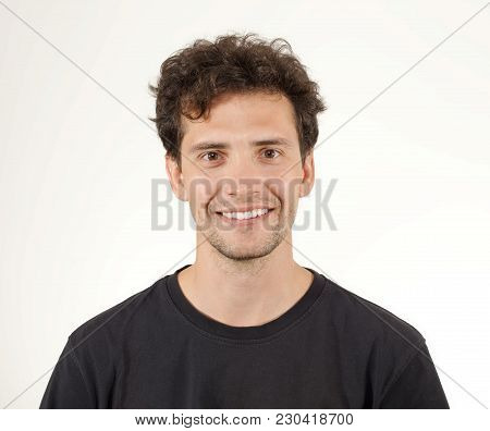 Close-up Portrait Of Smiling Guy In Black Shirt