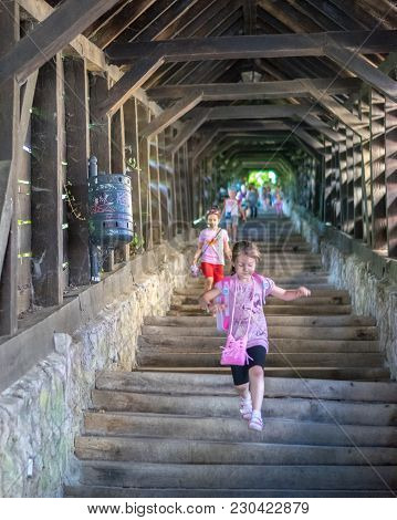 Sighisoara, Romania - 1 July 2016: Girls Running On The Scholars' Stairs, Built In 1642 In Sighisoar