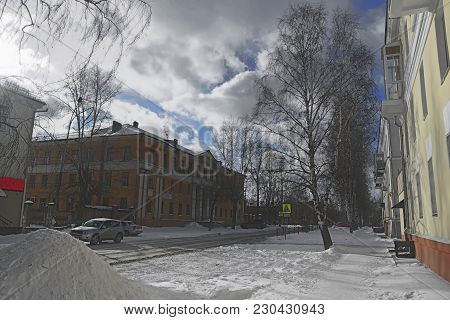 Walking In The Early Spring Along The City Street.