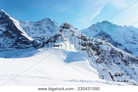 Mountain Peaks In Mannlichen In Winter Swiss Alps
