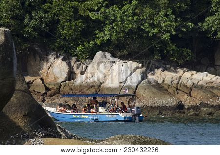 Pangkor Island, Malaysia - 17 December 2017 : Group Of Tourist Enjoy Exploring Pangkor Island Locate