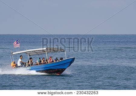 Pangkor Island, Malaysia - 17 December 2017 : Group Of Tourist Enjoy Exploring Pangkor Island Locate