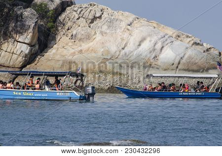 Pangkor Island, Malaysia - 17 December 2017 : Group Of Tourist Enjoy Exploring Pangkor Island Locate
