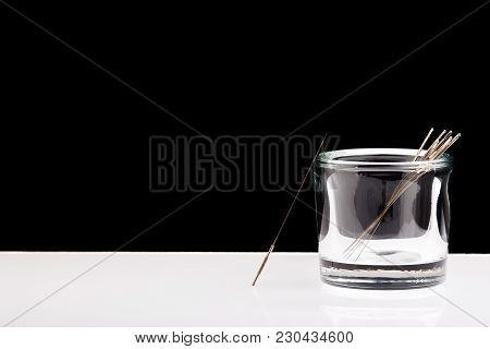 Silver Needles For Traditional Chinese Medicine Acupuncture. Close-up. Black And White Background. T
