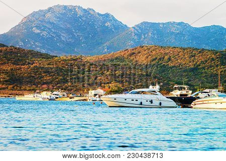 Sunrise With Yachts In Costa Smeralda At Mediterranean Sea, Sardinia, Italy