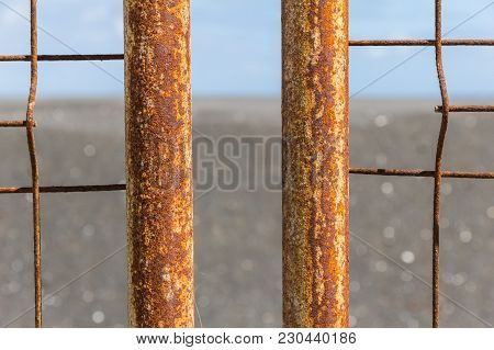 Iron Fence With Corrosion Before Ocean In La Palma.