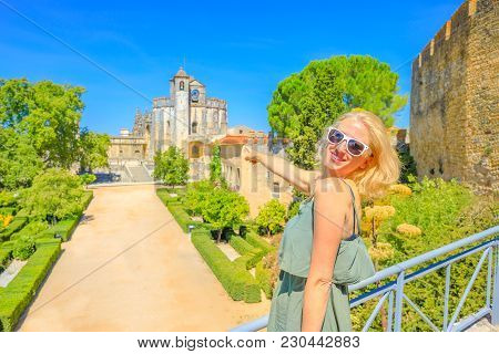 Convent Of Christ Landscape. Tourism In Portugal. Lifestyle Woman Pointing At Templar Monastery Or C