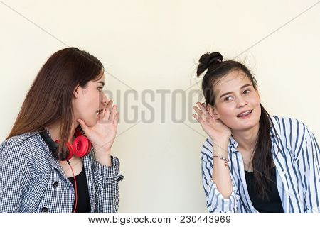 Two Pretty Cuter Teenagers  Sit And Watch Phone To Shares Secrets With Gossip And Entertainment At O