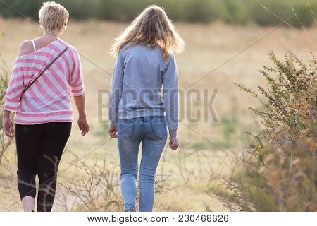 Two Girls Back To Nature . In The Park In Nature