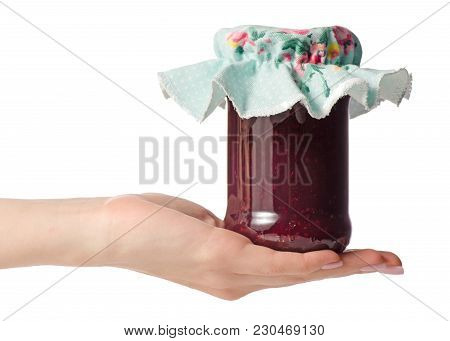 Raspberry Jam In A Jar In Hand On White Background Isolation