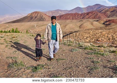 Abyaneh Village,  Isfahan Province, Iran - April 26, 2017:  A Mature Iranian Man Walks Down A Mounta