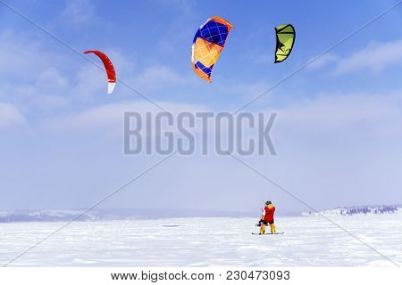 Perm, Russia - March 09, 2018: Snowkiters Rides On The Ice Of The Kama Reservoir